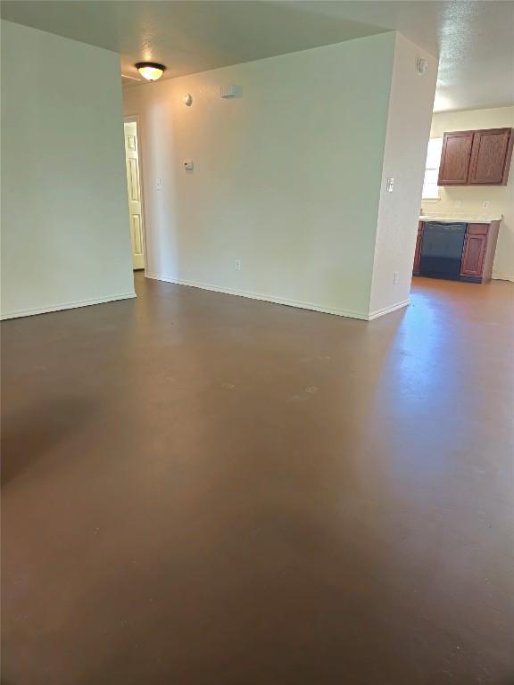 6637 River Oaks Dr, Kingsland, TX 78639 - spare room featuring concrete flooring and baseboards