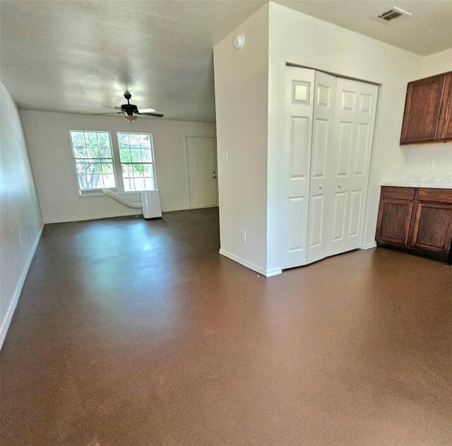6637 River Oaks Dr, Kingsland, TX 78639 - unfurnished living room with ceiling fan and baseboards