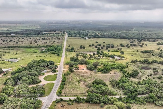 birds eye view of property with a rural view