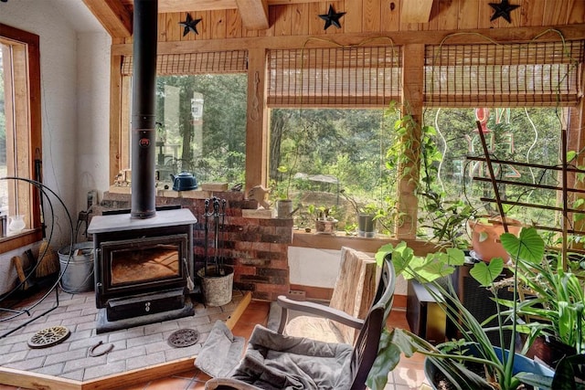 125 Turkey Trot Rd, Smithville, TX 78957 - sunroom with a wood stove and a wealth of natural light