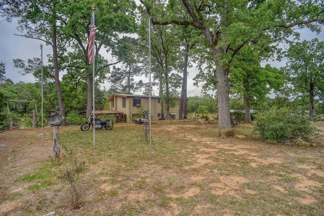 125 Turkey Trot Rd, Smithville, TX 78957 - view of yard with a carport