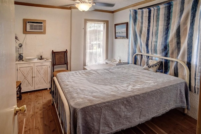 125 Turkey Trot Rd, Smithville, TX 78957 - bedroom with a wall mounted air conditioner, ceiling fan, hardwood / wood-style flooring, and ornamental molding