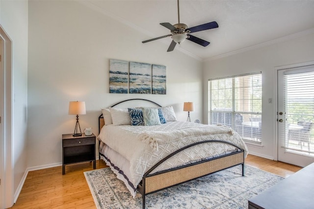 3404 American Dr Unit 2306, Lago Vista, TX 78645 - bedroom featuring crown molding, access to outside, light wood-style floors, baseboards, and vaulted ceiling