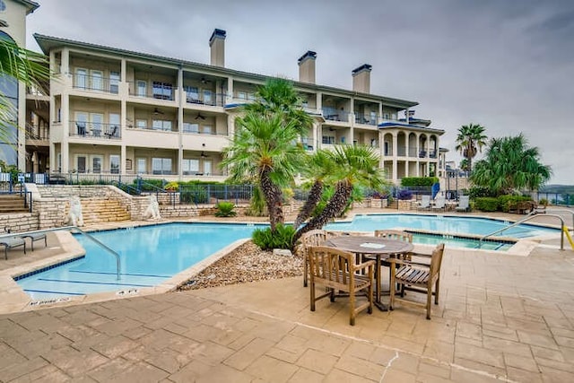 3404 American Dr Unit 2306, Lago Vista, TX 78645 - pool with fence and a patio area