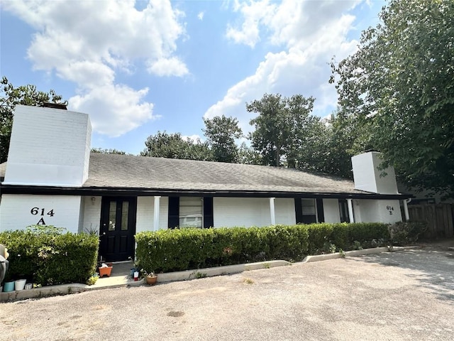 view of front of property featuring a chimney