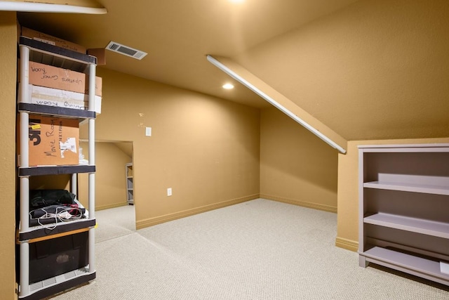 bonus room featuring visible vents, carpet, lofted ceiling, and baseboards