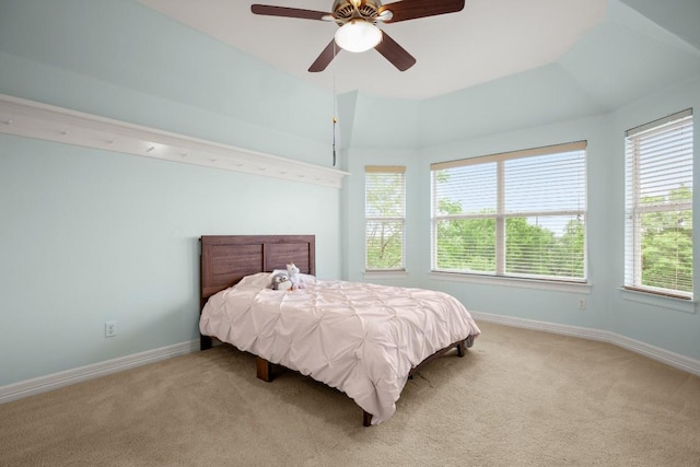 bedroom featuring carpet floors, a ceiling fan, and baseboards