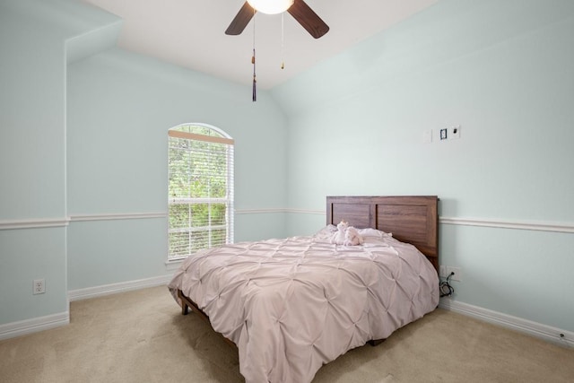 bedroom with carpet floors, baseboards, ceiling fan, and vaulted ceiling