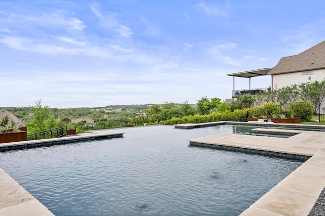 view of swimming pool featuring fence and a fenced in pool