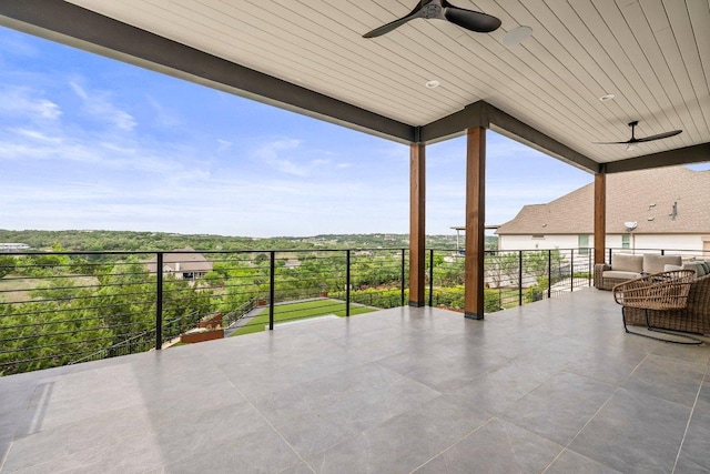 view of patio featuring ceiling fan, outdoor lounge area, and a balcony
