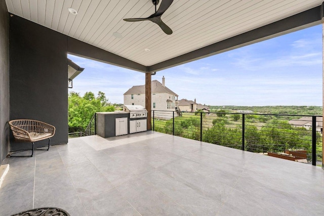 view of patio with ceiling fan and a grill
