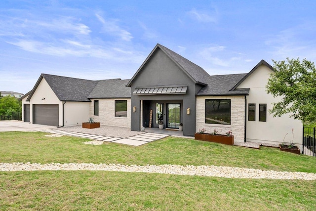modern farmhouse style home featuring a shingled roof, an attached garage, a front lawn, stone siding, and concrete driveway