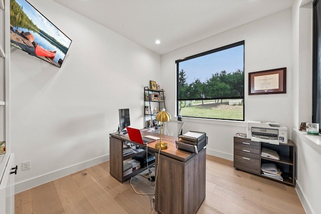 home office with recessed lighting, baseboards, and light wood-type flooring