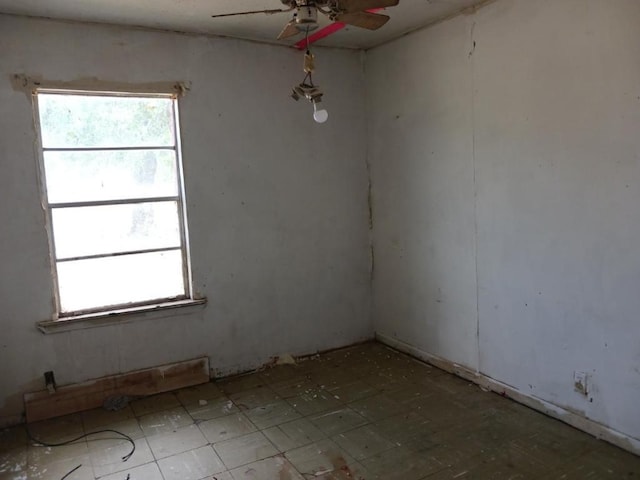 spare room with ceiling fan