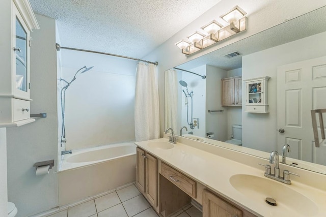 16901 Gower St, Pflugerville, TX 78660 - full bath featuring toilet, shower / tub combo with curtain, tile patterned floors, a textured ceiling, and double vanity