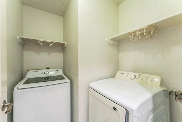 laundry area with laundry area and independent washer and dryer