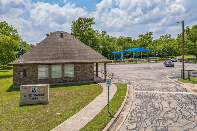 16901 Gower St, Pflugerville, TX 78660 - view of property's community featuring a yard and uncovered parking