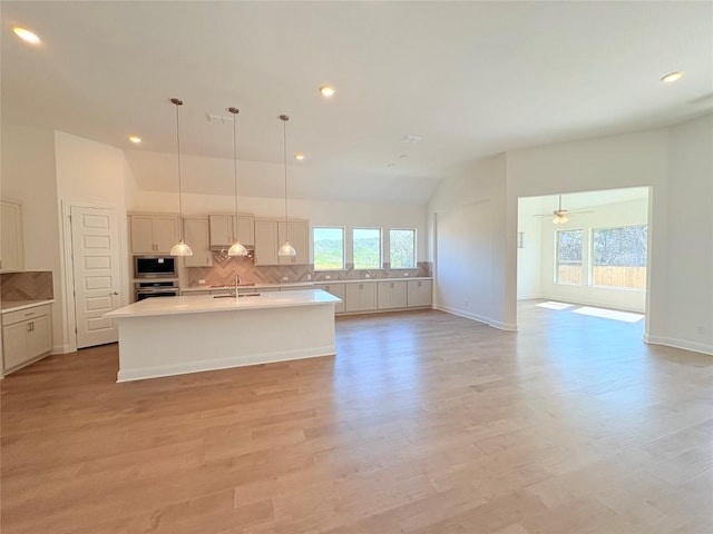 1728 Scenic Heights Ln, Georgetown, TX 78628 - kitchen featuring appliances with stainless steel finishes, a sink, plenty of natural light, lofted ceiling, and decorative backsplash