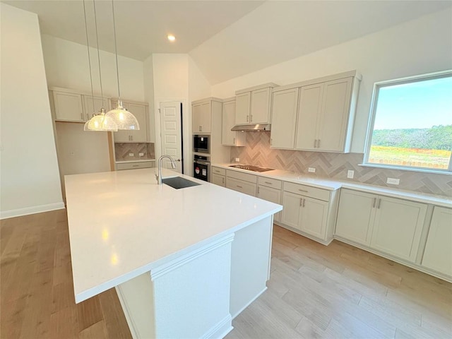 1728 Scenic Heights Ln, Georgetown, TX 78628 - kitchen featuring a sink, black electric cooktop, oven, tasteful backsplash, and under cabinet range hood