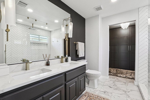 full bath featuring a sink, toilet, marble finish floor, and visible vents