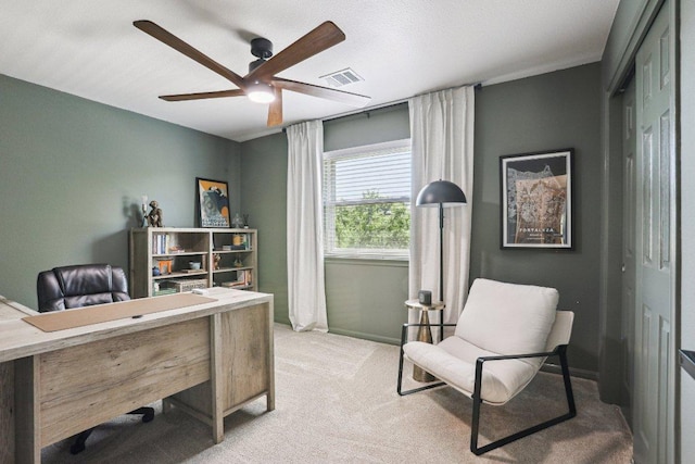 office with baseboards, ceiling fan, carpet flooring, and visible vents