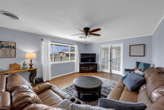 1309 E Brown St, Llano, TX 78643 - living room with ceiling fan, wood finished floors, and crown molding