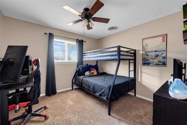 1309 E Brown St, Llano, TX 78643 - carpeted bedroom featuring baseboards and ceiling fan