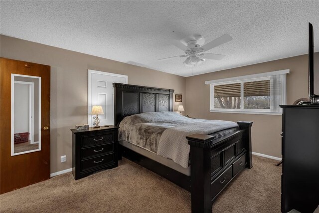 1309 E Brown St, Llano, TX 78643 - carpeted bedroom featuring a textured ceiling and a ceiling fan