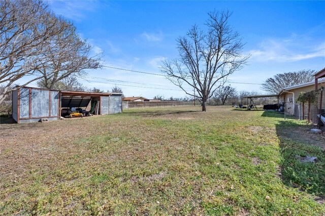 1309 E Brown St, Llano, TX 78643 - view of yard featuring an outbuilding and an outdoor structure