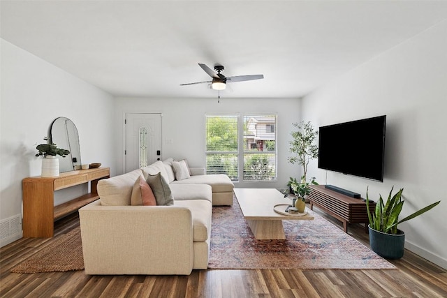 living room featuring baseboards, ceiling fan, wood finished floors, and visible vents