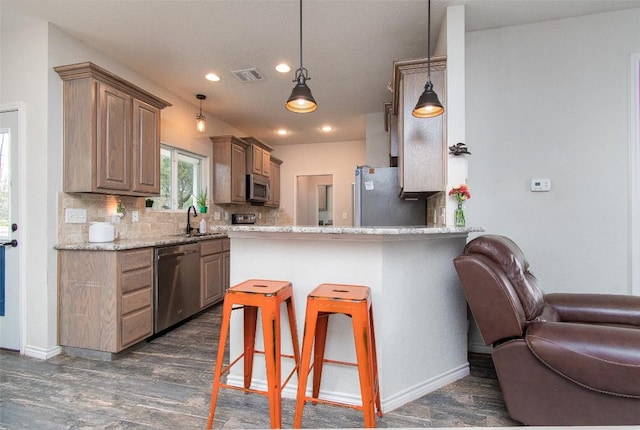 kitchen featuring visible vents, dark wood-style flooring, recessed lighting, a sink, and appliances with stainless steel finishes