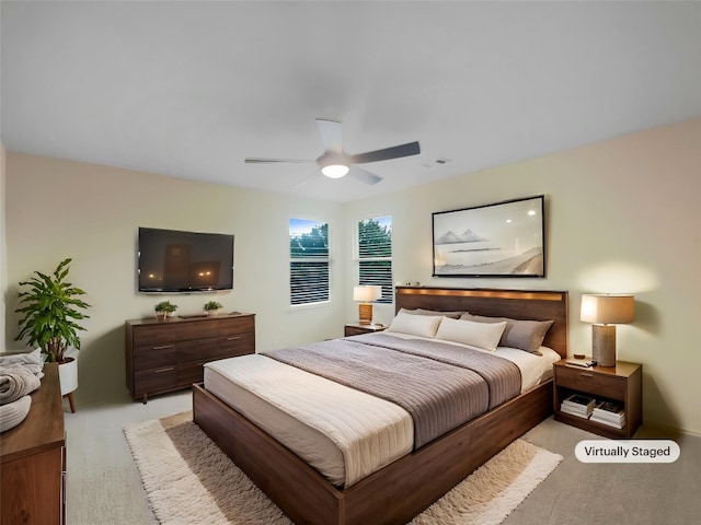 181 Otono Loop, Kyle, TX 78640 - bedroom featuring light carpet and a ceiling fan