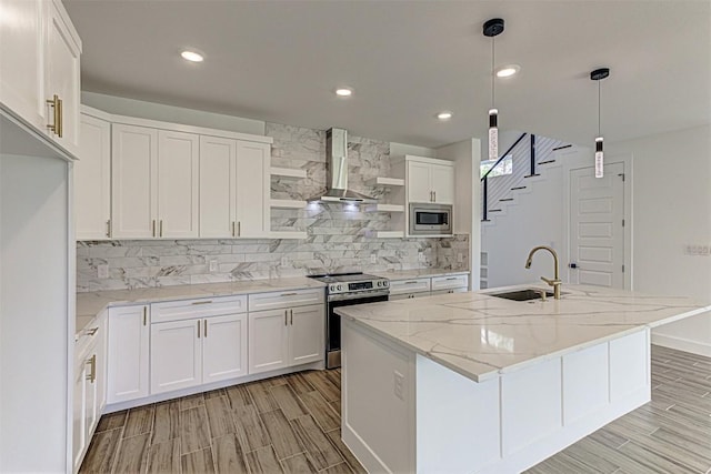 141 Awehi Ln, Bastrop, TX 78602 - kitchen with stainless steel appliances, wall chimney range hood, open shelves, tasteful backsplash, and white cabinets