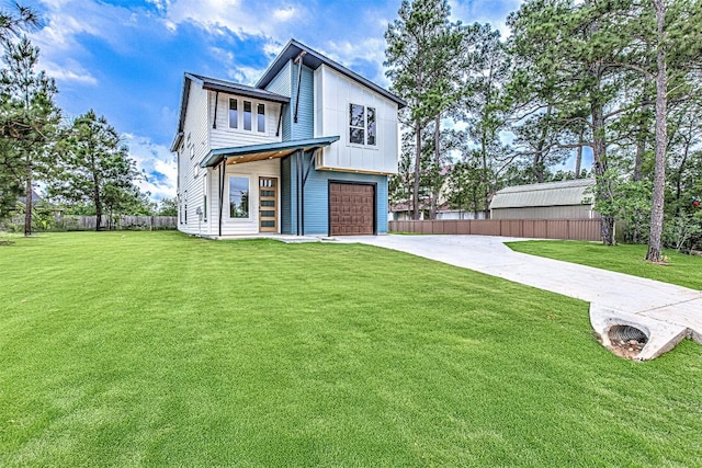 141 Awehi Ln, Bastrop, TX 78602 - back of house featuring concrete driveway and an attached garage