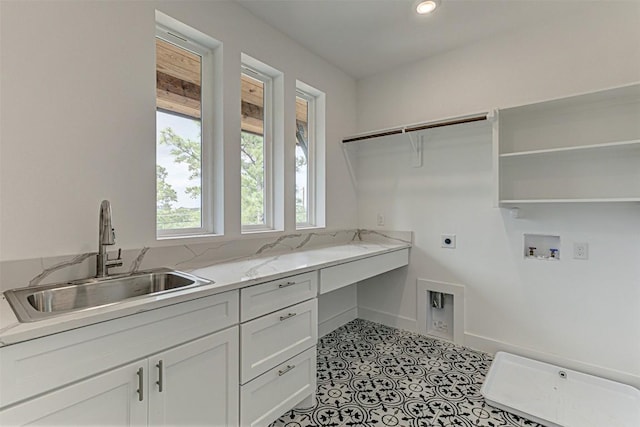 141 Awehi Ln, Bastrop, TX 78602 - laundry area featuring electric dryer hookup, cabinet space, washer hookup, baseboards, and recessed lighting