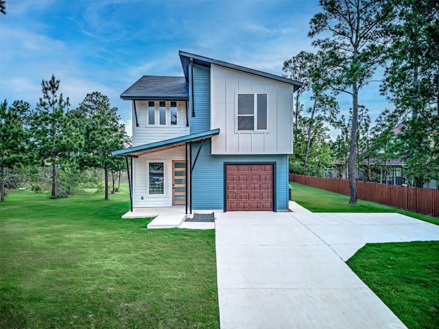 141 Awehi Ln, Bastrop, TX 78602 - contemporary home featuring board and batten siding, a garage, and driveway