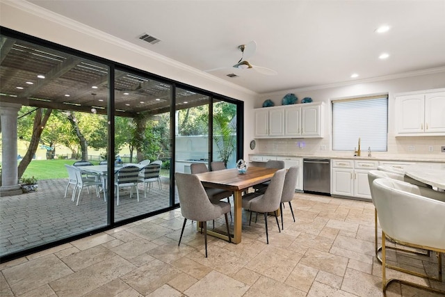 dining room featuring stone tile flooring, ornamental molding, visible vents, ceiling fan, and recessed lighting