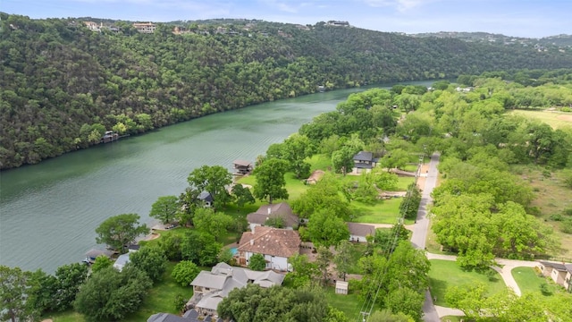 bird's eye view with a water view and a forest view