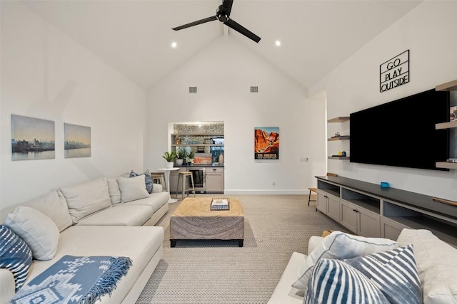 living room with ceiling fan, light colored carpet, high vaulted ceiling, recessed lighting, and baseboards