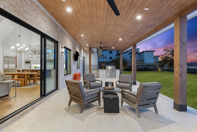 view of patio / terrace with an outdoor living space, a ceiling fan, and area for grilling