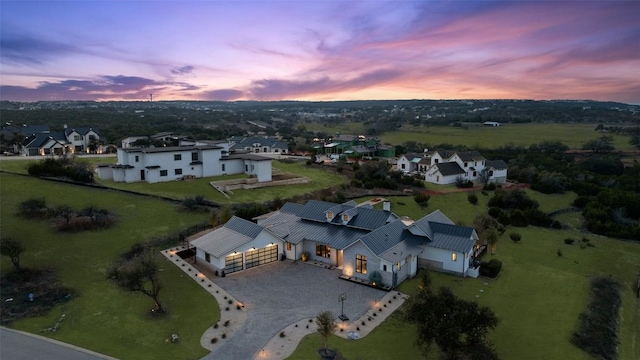 aerial view at dusk with a residential view