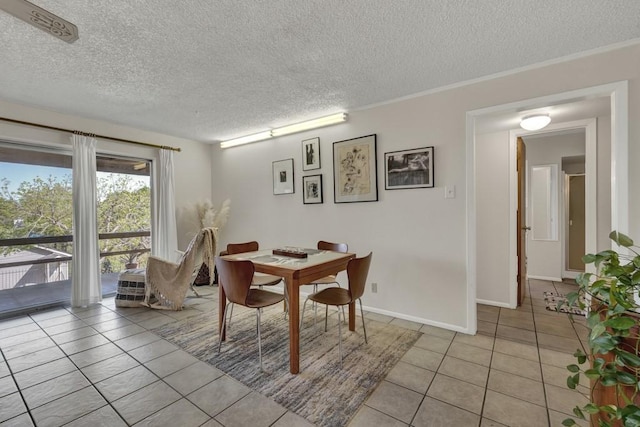 1871 Patty Dr, Canyon Lake, TX 78133 - dining room featuring light tile patterned floors and a textured ceiling