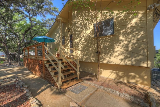 1871 Patty Dr, Canyon Lake, TX 78133 - view of home's exterior featuring stairway and a wooden deck