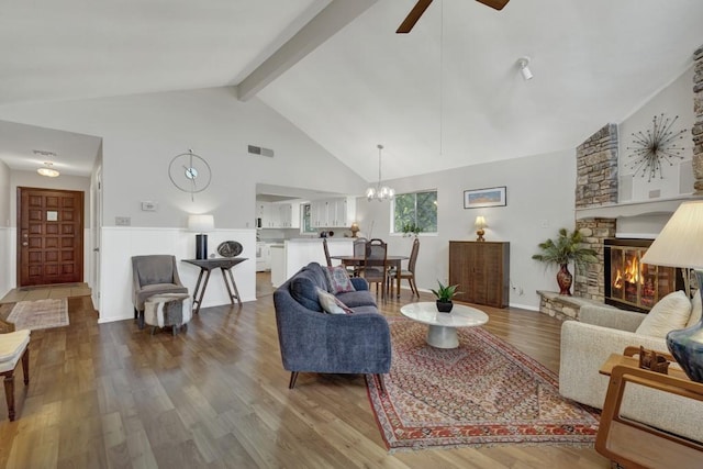 1871 Patty Dr, Canyon Lake, TX 78133 - living room with a fireplace, a chandelier, high vaulted ceiling, ceiling fan, and wood finished floors