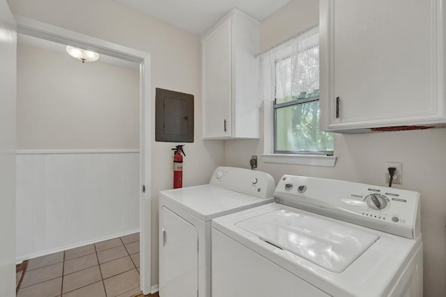 1871 Patty Dr, Canyon Lake, TX 78133 - laundry room featuring electric panel, separate washer and dryer, cabinet space, a wainscoted wall, and light tile patterned flooring