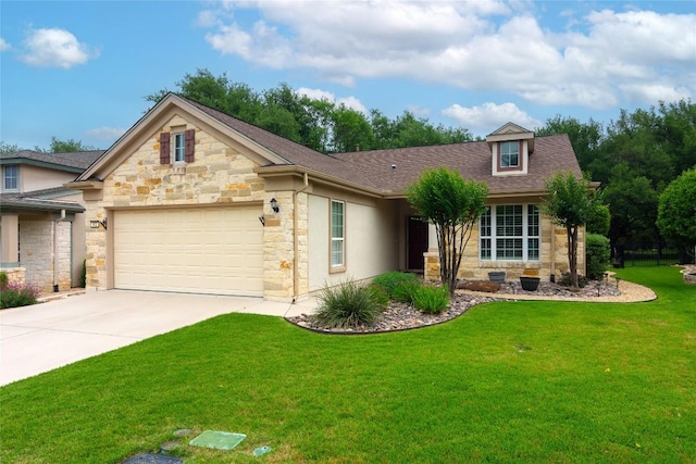 view of front of property with roof with shingles, a front lawn, stone siding, a garage, and concrete driveway