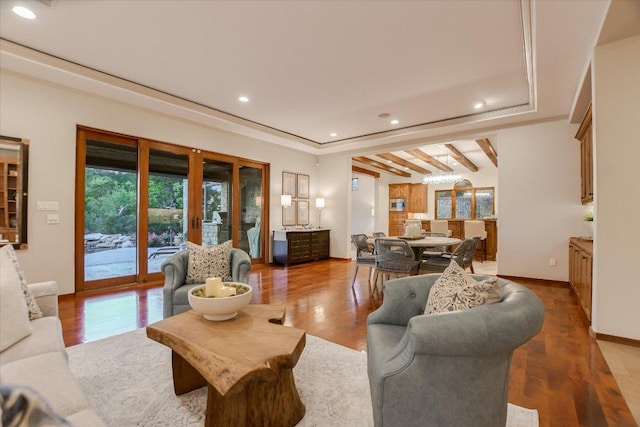living area with baseboards, recessed lighting, and wood finished floors