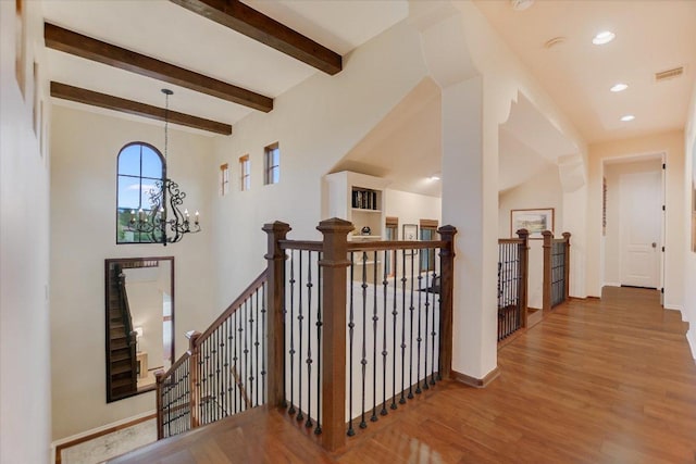 5525 City Park Rd Unit 6, Austin, TX 78730 - hallway featuring an upstairs landing, a chandelier, wood finished floors, beamed ceiling, and recessed lighting