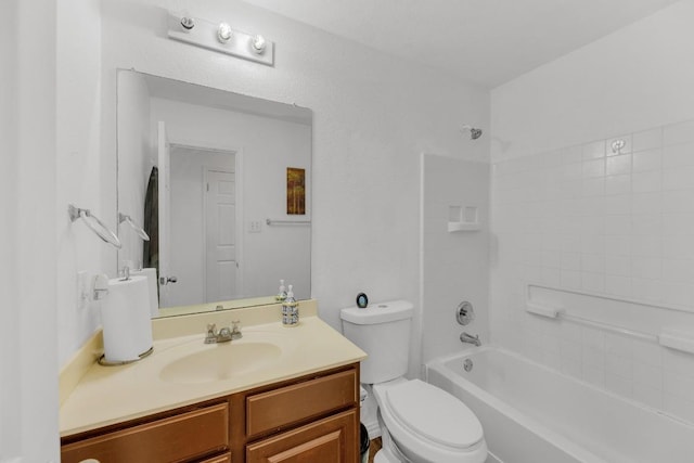 full bath featuring vanity, bathtub / shower combination, and toilet