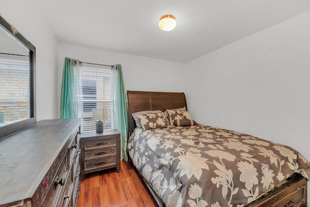bedroom with wood finished floors